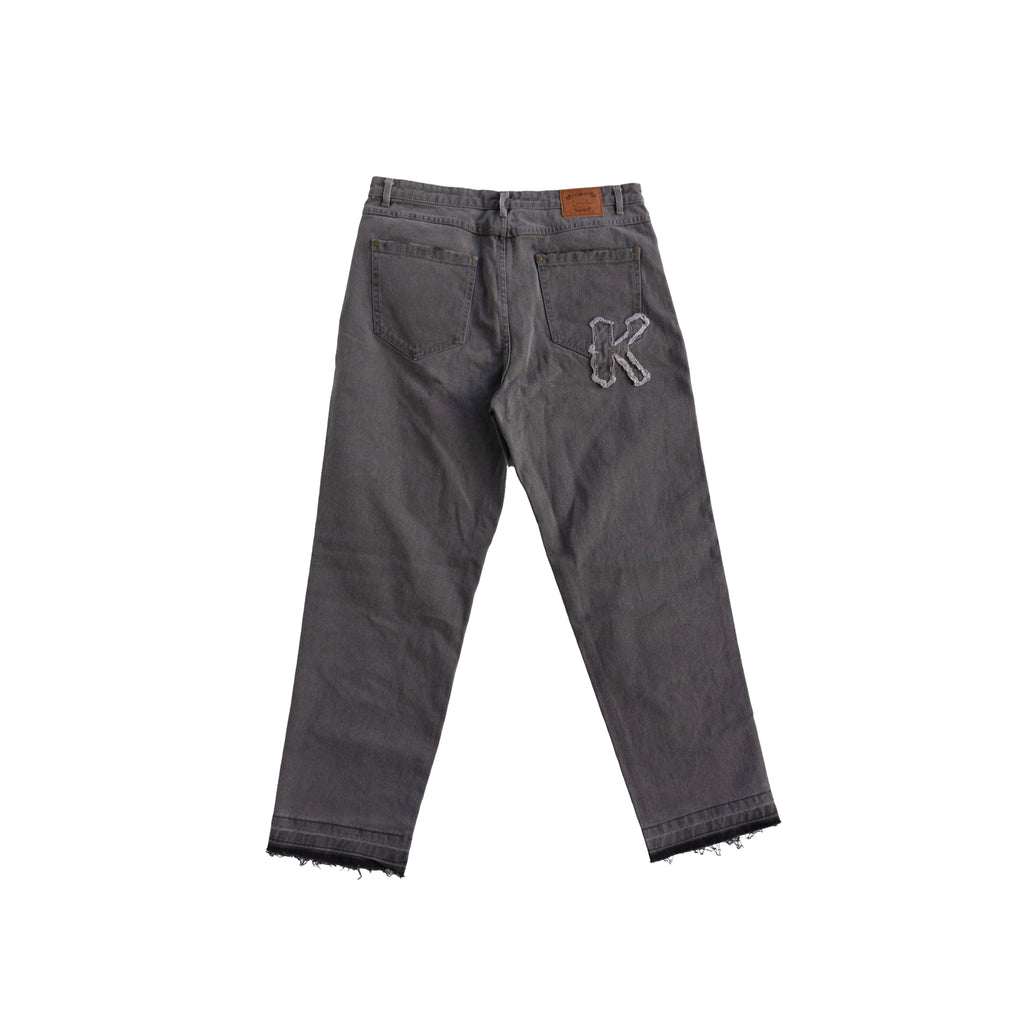 KARL KANI DISTRESSED LOGO JEANS – GREY