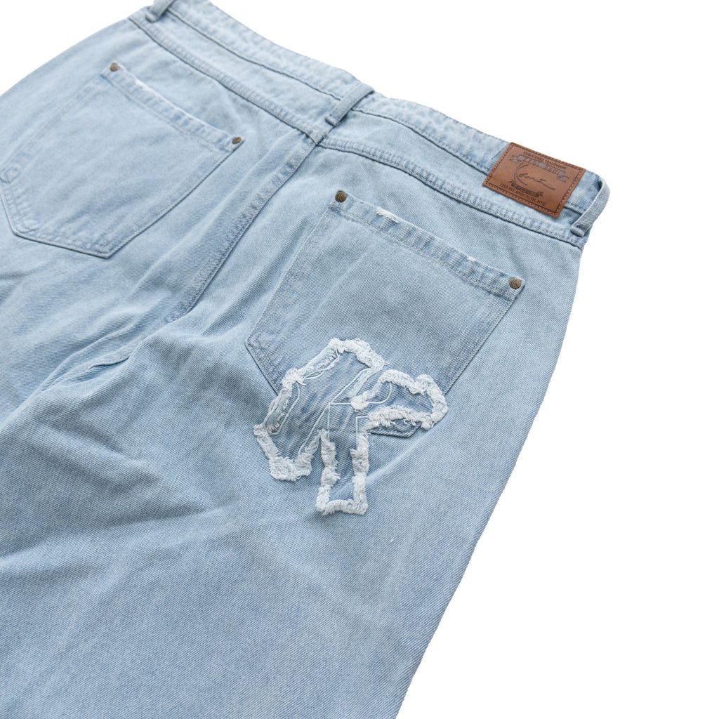 KARL KANI DISTRESSED LOGO BAGGY JEANS – LIGHT BLUE