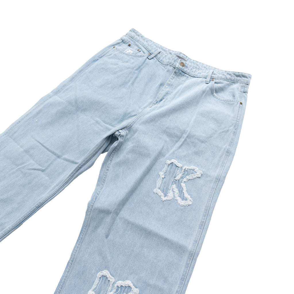 KARL KANI DISTRESSED LOGO BAGGY JEANS – LIGHT BLUE