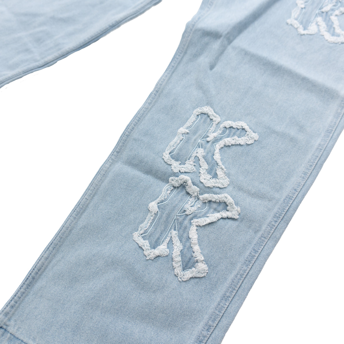 KARL KANI DISTRESSED LOGO BAGGY JEANS – LIGHT BLUE